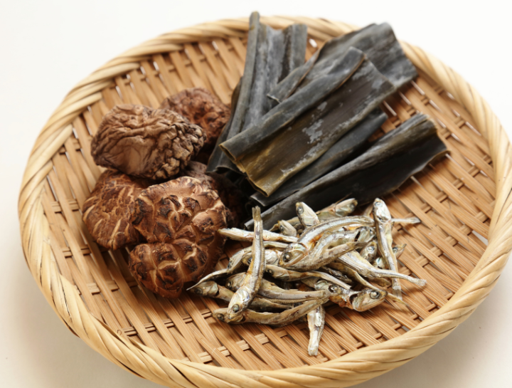 ingredients for making dashi, including kombu (dried kelp) and katsuobushi (dried bonito flakes), essential elements for creating the flavorful Japanese broth